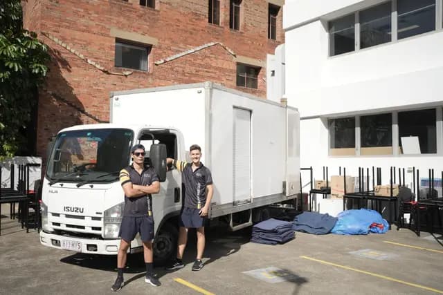 Local removalists moving furniture from a Brisbane apartment